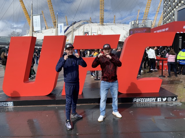 Stood infront of the UFC letters